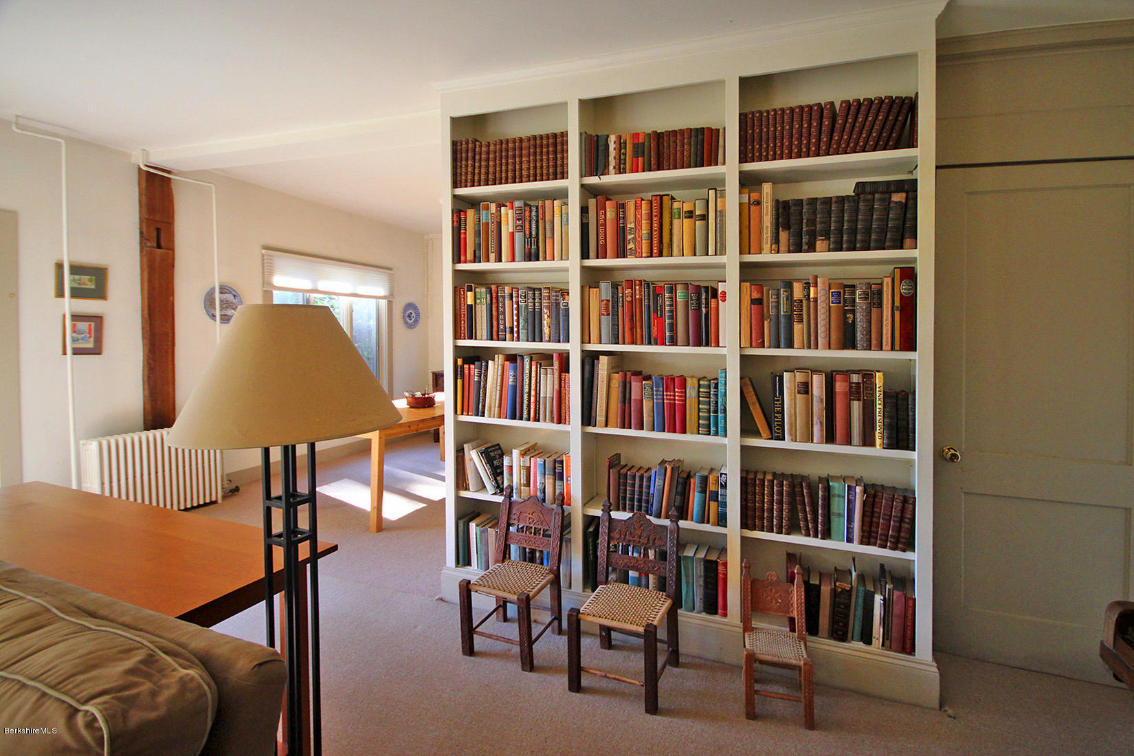 20 Main Street Stockbridge, MA 01262 - Photo 31 of 40 a living room with furniture and a book shelf