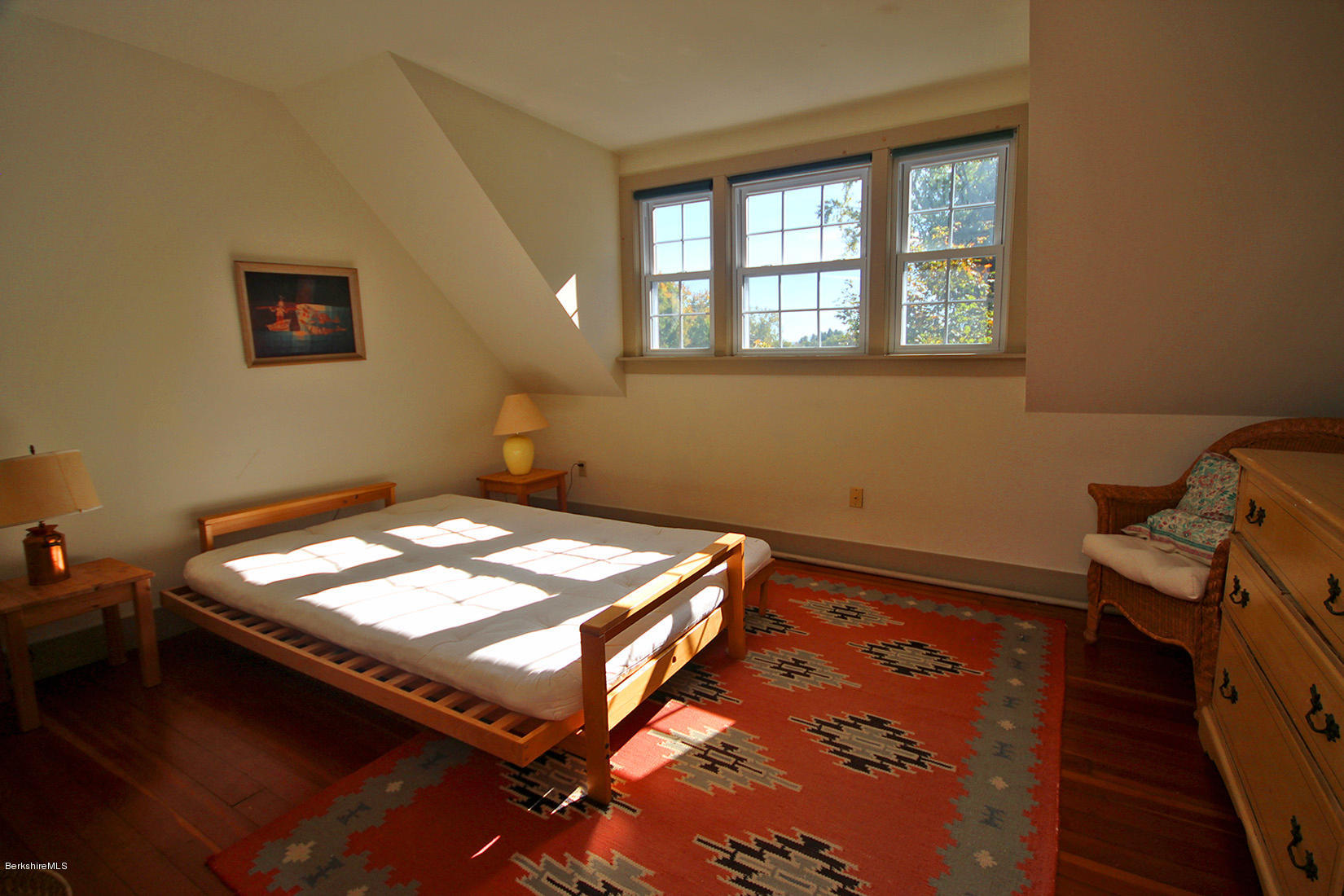 20 Main Street Stockbridge, MA 01262 - Photo 36 of 40 a bed sitting in a room next to a window