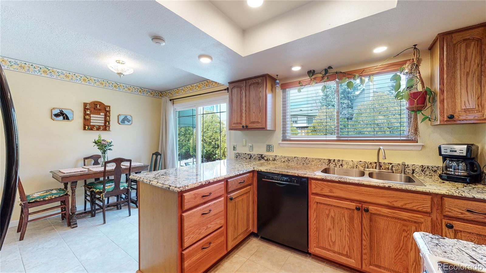 955 Northridge Road Highlands Ranch, CO 80126 - Photo 14 of 37 a kitchen with a sink stove and cabinets