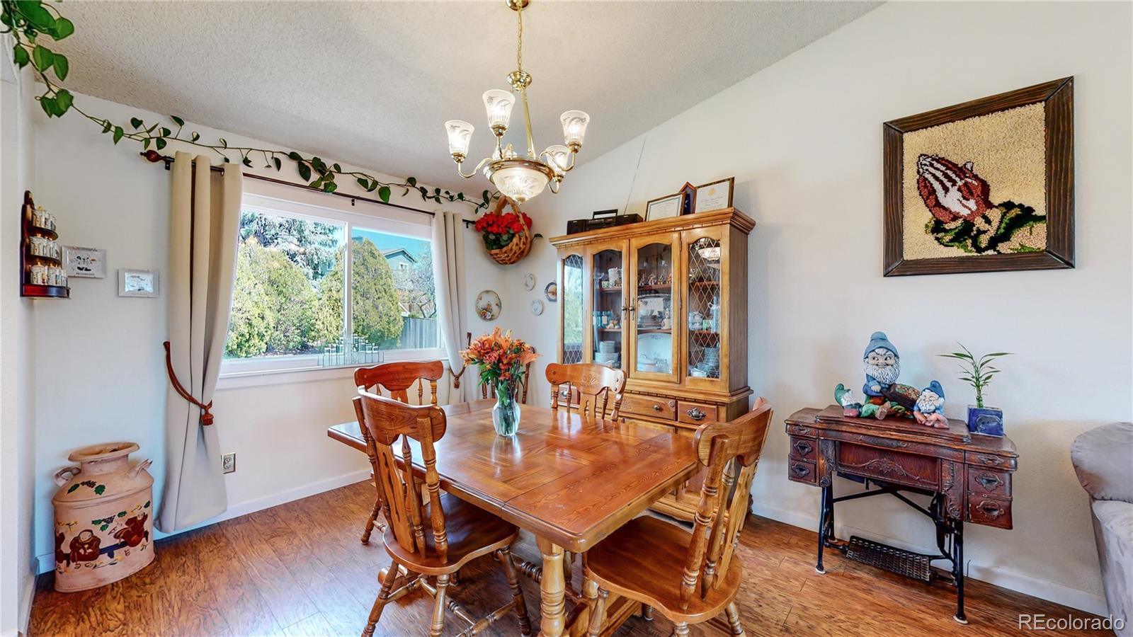 955 Northridge Road Highlands Ranch, CO 80126 - Photo 9 of 37 a view of a dining room with furniture window and wooden floor