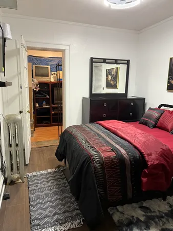 a bedroom with a bed and a walk in closet