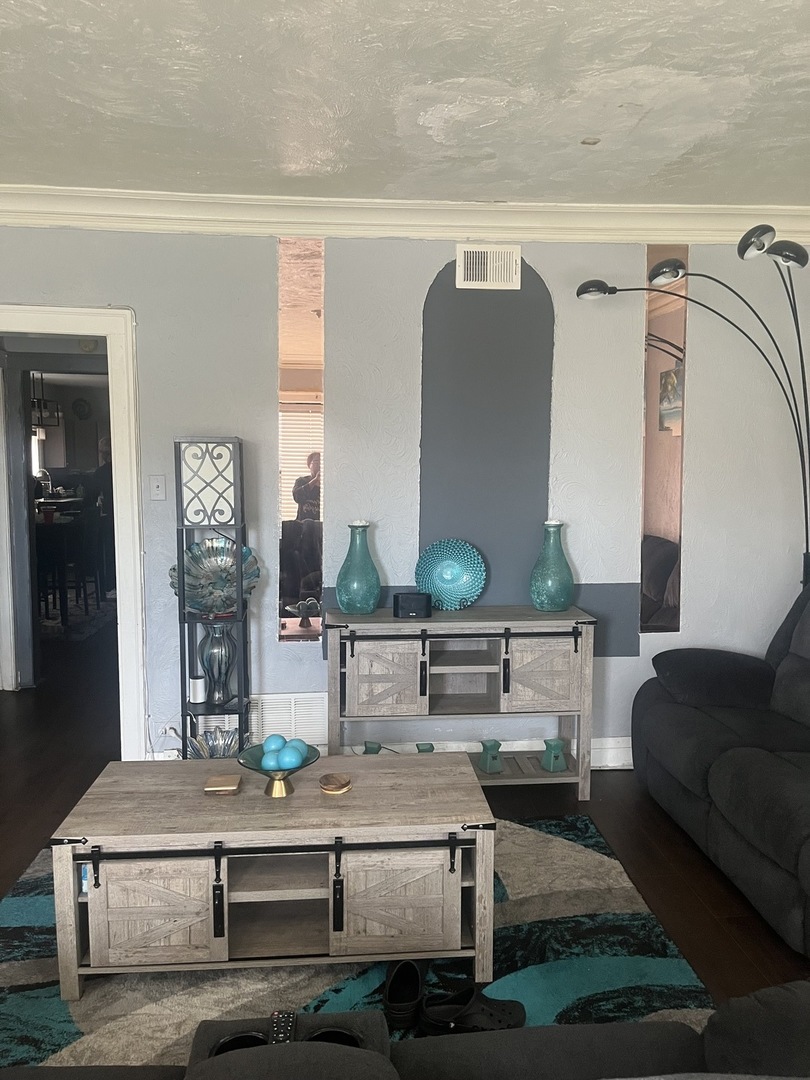 7825 South Paulina Street Chicago, IL 60620 - Photo 18 of 34 a living room with furniture and lamp