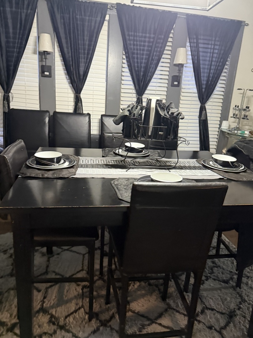 7825 South Paulina Street Chicago, IL 60620 - Photo 19 of 34 a kitchen with a table chairs and a sink