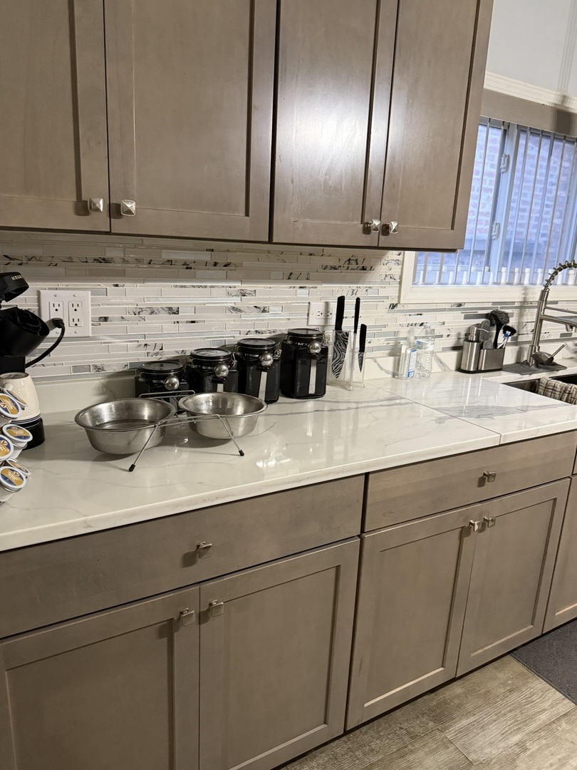7825 South Paulina Street Chicago, IL 60620 - Photo 22 of 34 a kitchen with stainless steel appliances granite countertop a sink and cabinets
