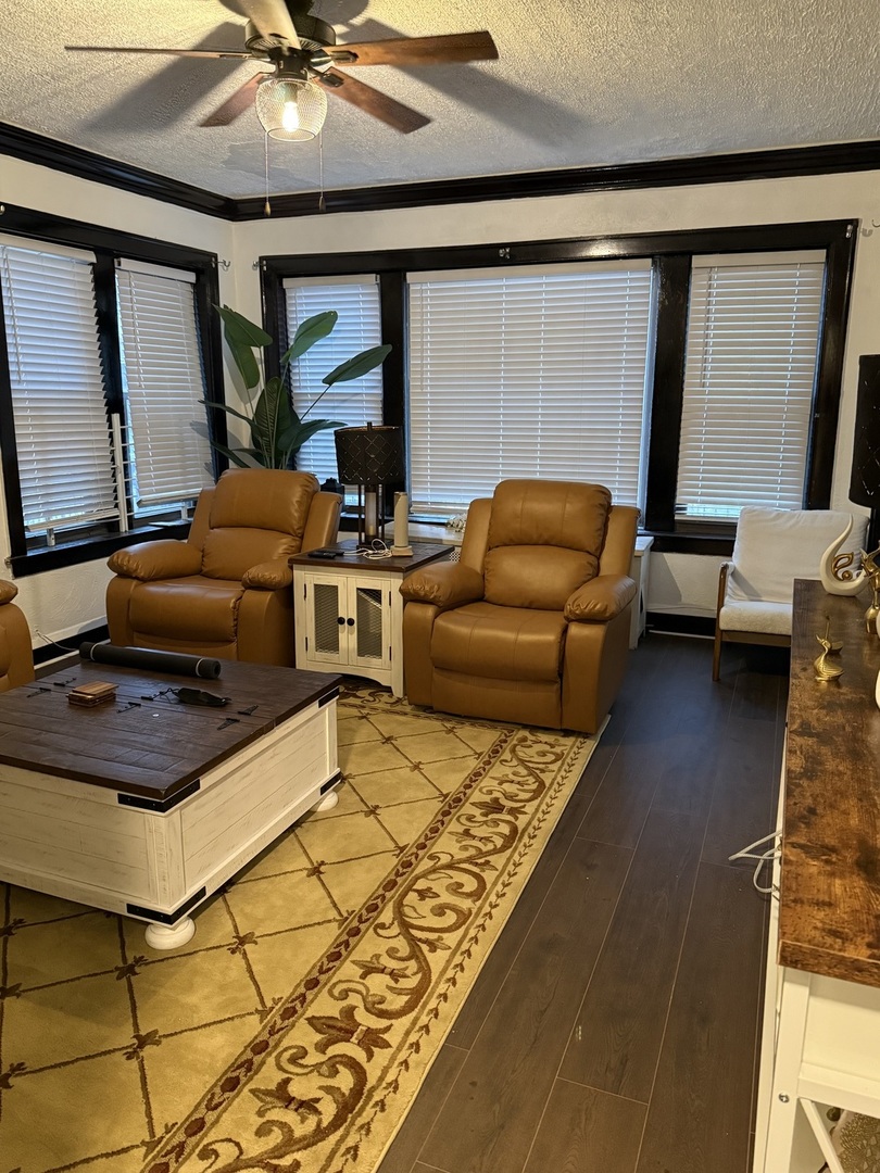 7825 South Paulina Street Chicago, IL 60620 - Photo 3 of 34 a living room with furniture and a flat screen tv