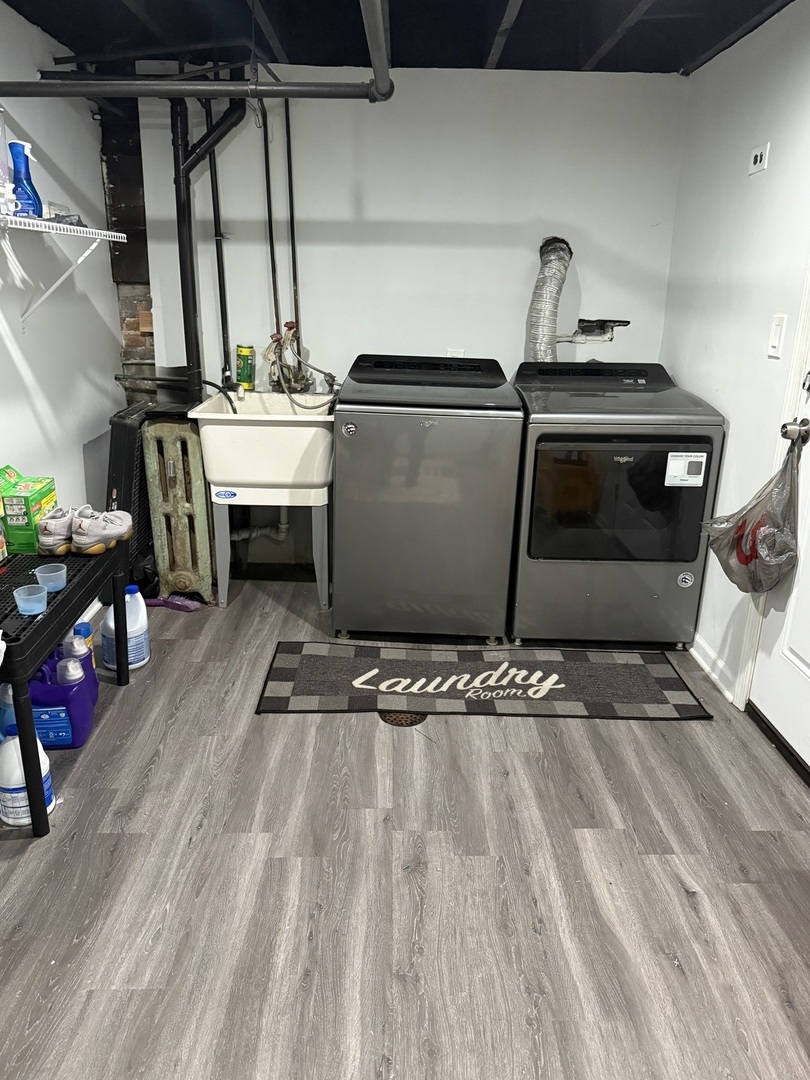 7825 South Paulina Street Chicago, IL 60620 - Photo 33 of 34 a kitchen with stainless steel appliances granite countertop a sink stove and cabinets