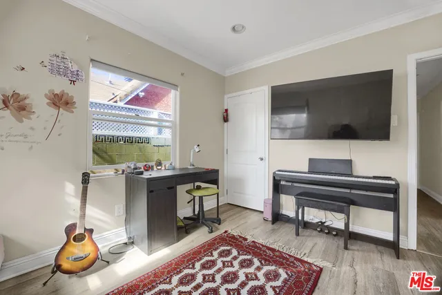 a living room with furniture and painting on the wall