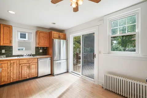 a kitchen with stainless steel appliances granite countertop a refrigerator and a sink