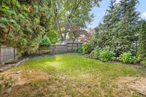 a view of a backyard with a garden