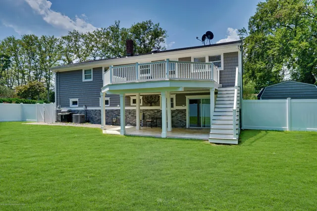 a view of a backyard with a garden and trees