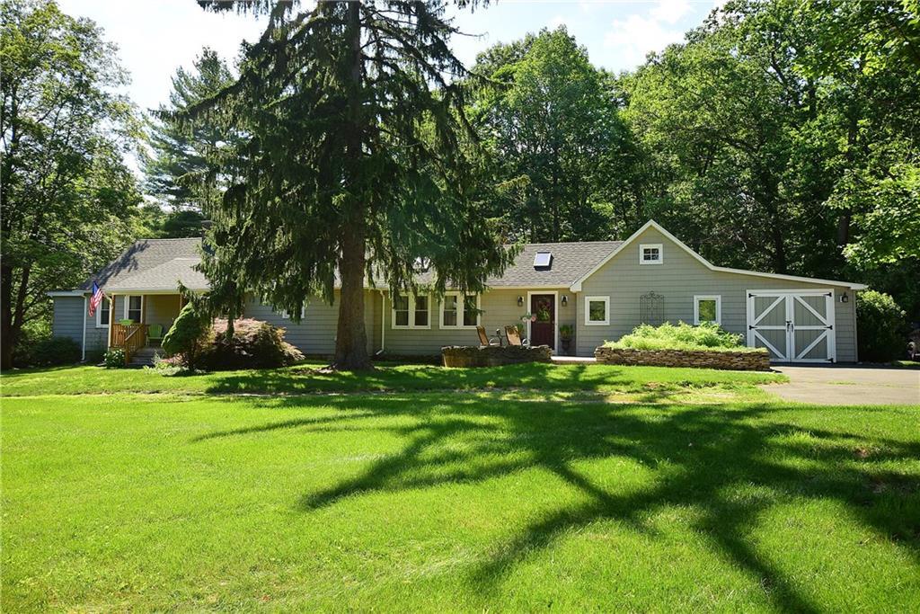 7 Moosehorn Road Granby, CT 06090 - Photo 1 of 1 a front view of a house with garden