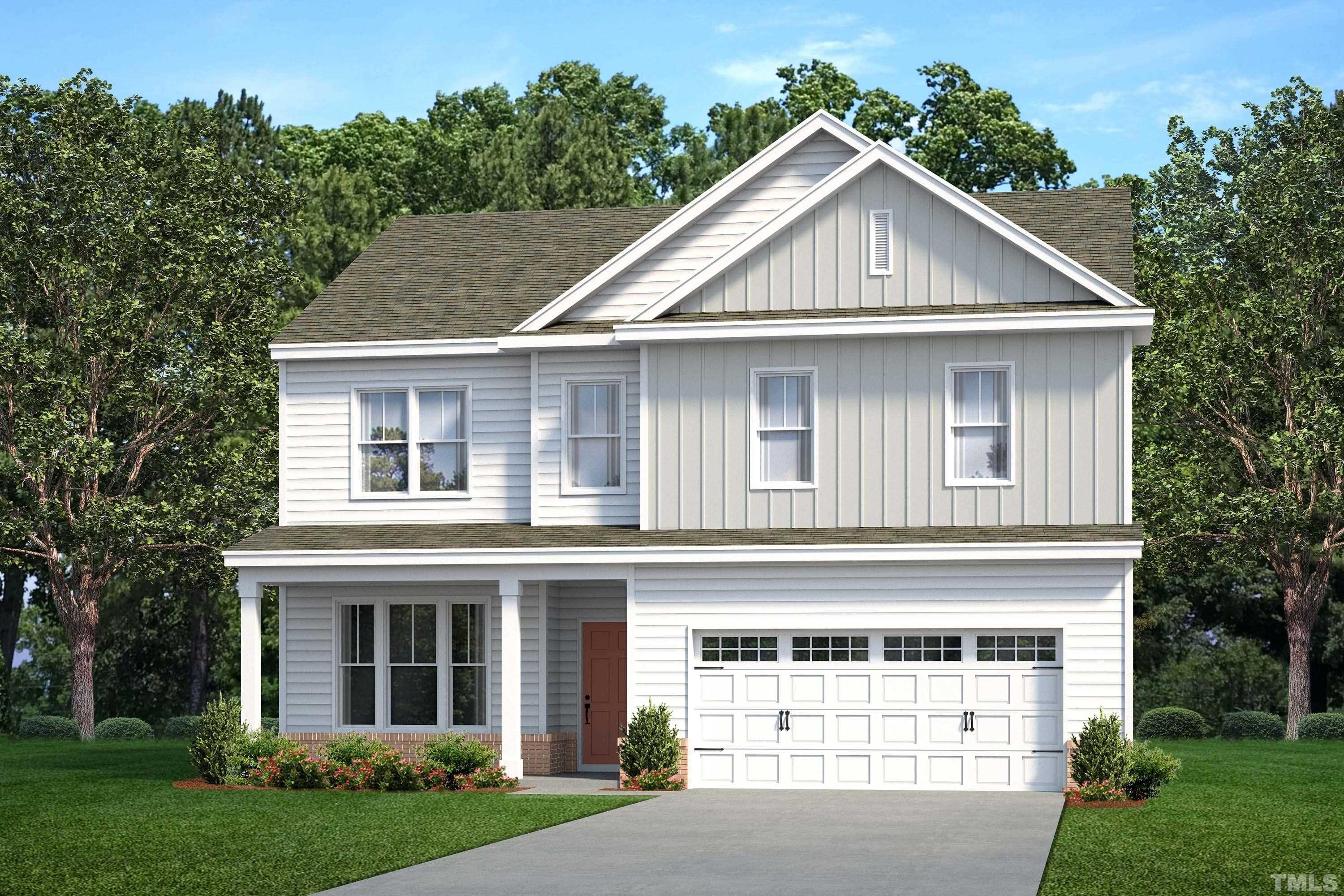 249 Pierce Lndg Drive Garner, NC 27529 - Photo 1 of 11 a front view of a house with a yard and garage