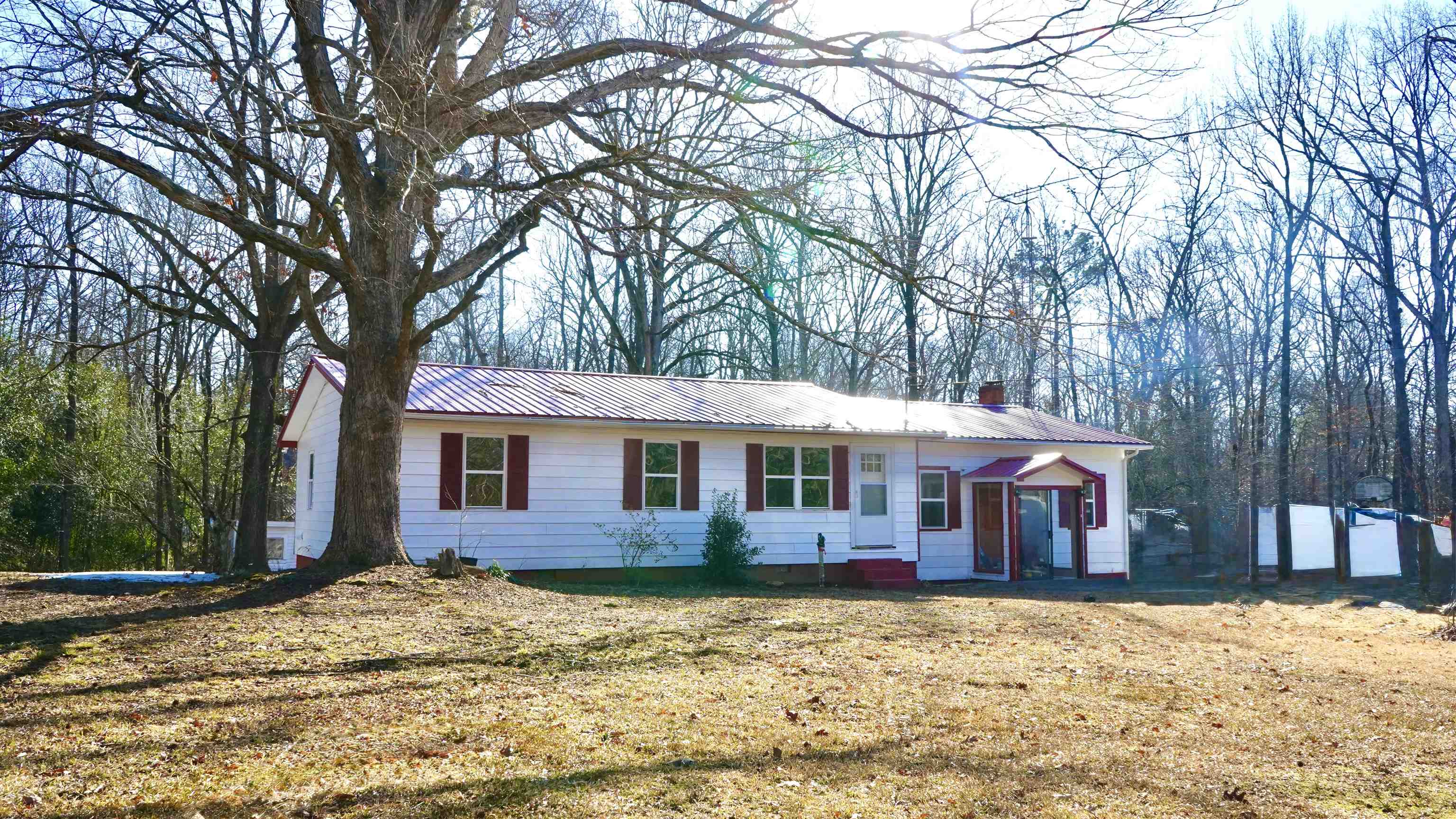 120 Rhodes Drive Middleton, TN 38052 - Photo 11 of 16 Single story home featuring a metal roof, a chimney, and a front yard