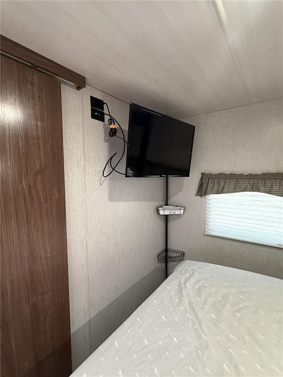 3000 Clarcona Road, Unit 743 Apopka, FL 32703 - Photo 37 of 54 a bedroom with a bed and a window