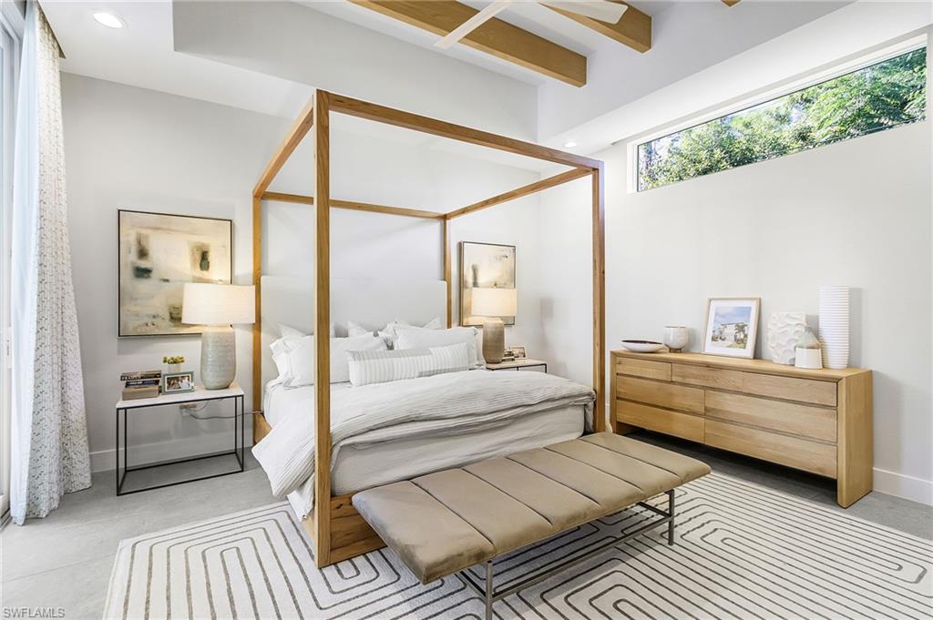 591 93rd Avenue North Naples, FL 34108 - Photo 12 of 35 1st floor primary bedroom with sliders leading to pool.