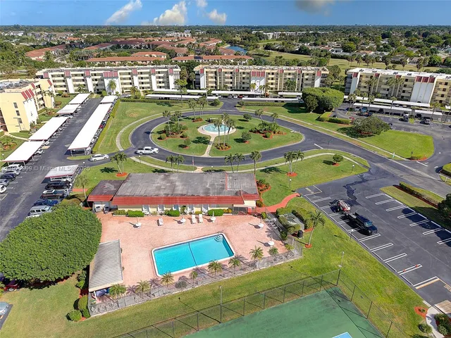 an aerial view of a house with a swimming pool
