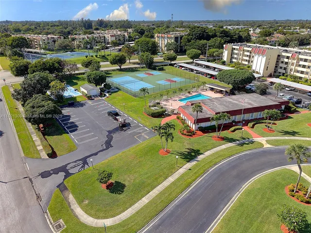 an aerial view of a pool patio patio and outdoor seating