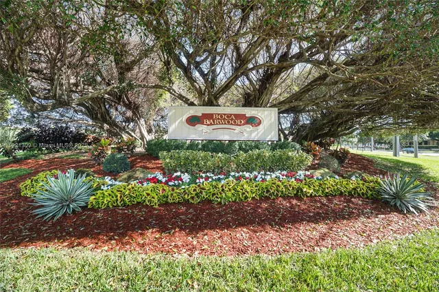 a sign that is sitting in a garden