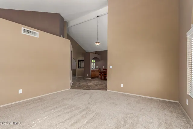 a view of a big room with closet and windows