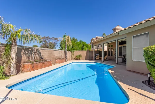 a view of a backyard of the house