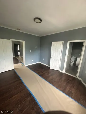 a view of a hallway view with staircase