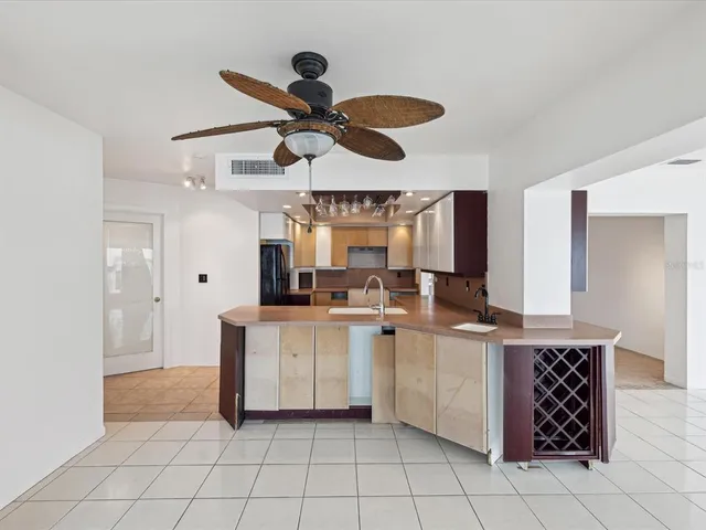 a spacious bathroom with a sink a mirror and a shower