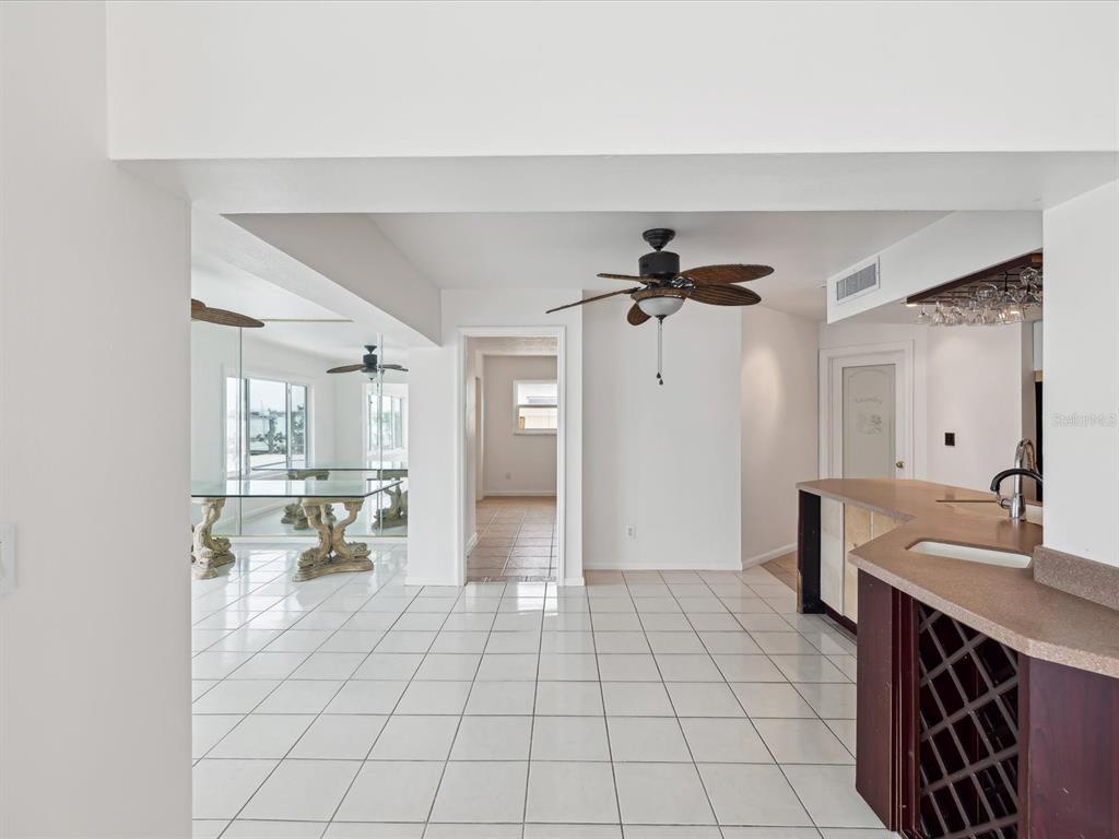 11549 48th Avenue North St. Petersburg, FL 33708 - Photo 14 of 37 a spacious bathroom with a sink a mirror and a shower