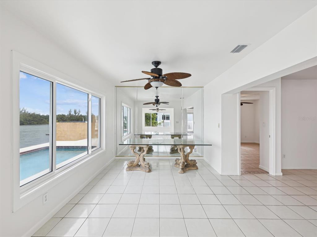 11549 48th Avenue North St. Petersburg, FL 33708 - Photo 16 of 37 a living room with furniture and a large window
