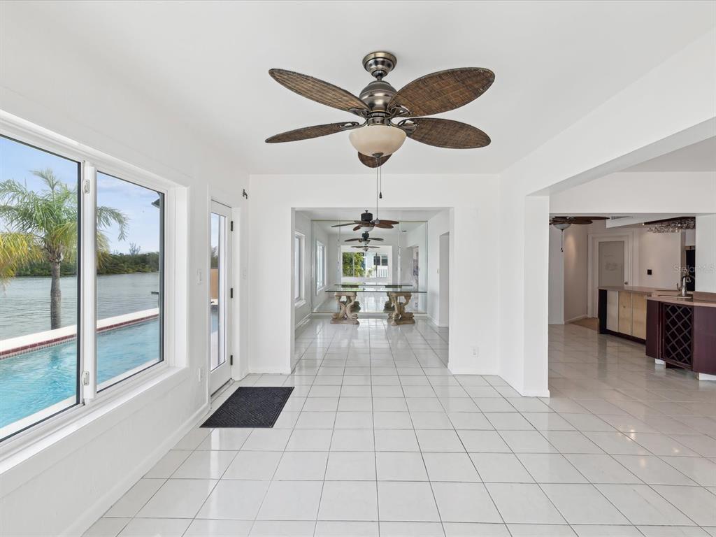 11549 48th Avenue North St. Petersburg, FL 33708 - Photo 19 of 37 a view of a livingroom with a ceiling fan and window
