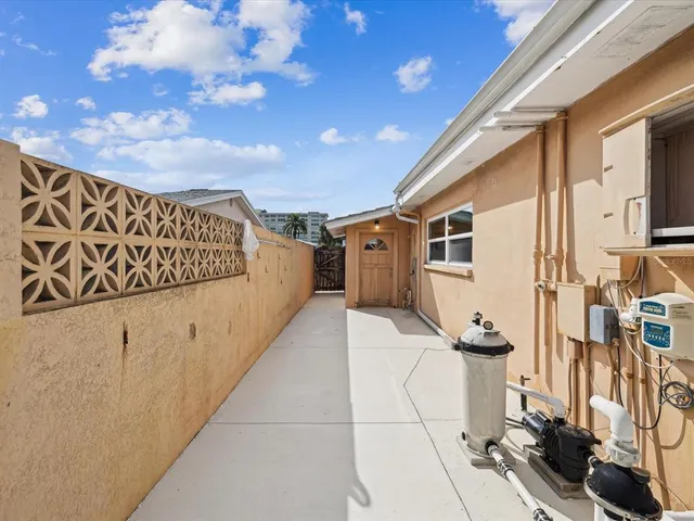 a view of a swimming pool with an outdoor seating