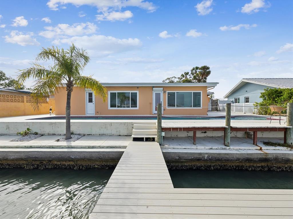 11549 48th Avenue North St. Petersburg, FL 33708 - Photo 29 of 37 a bathroom with a sink and a mirror