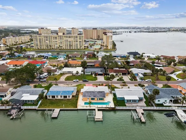 a aerial view of a house with lake view and boat
