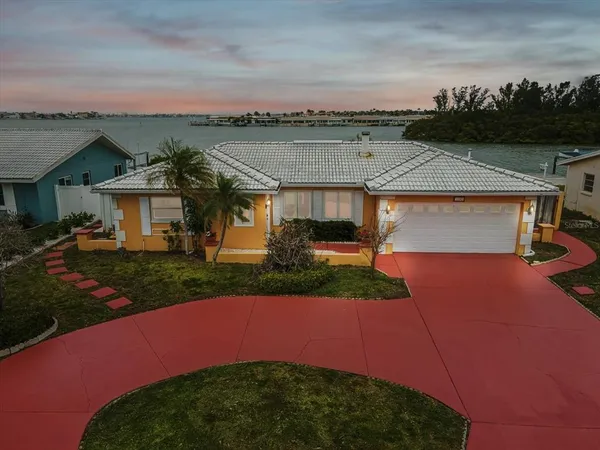 a swimming pool with outdoor seating and yard in back