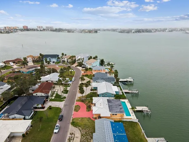 a view of a hallway with wooden shelves