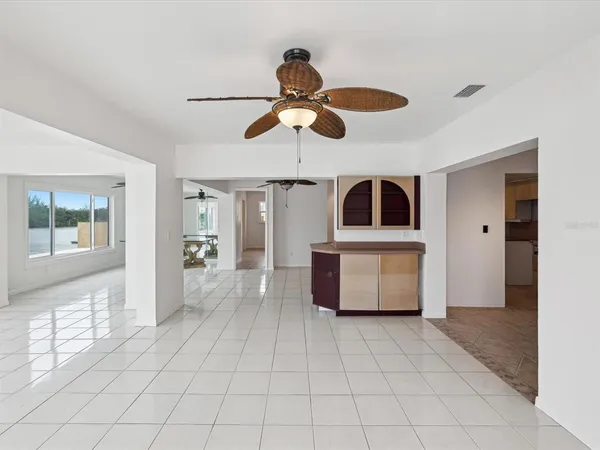 a kitchen with stainless steel appliances granite countertop a refrigerator and a microwave