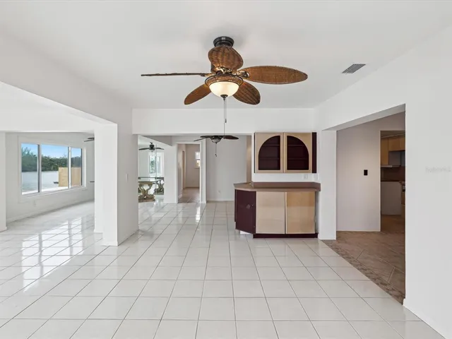 a kitchen with stainless steel appliances granite countertop a refrigerator and a microwave