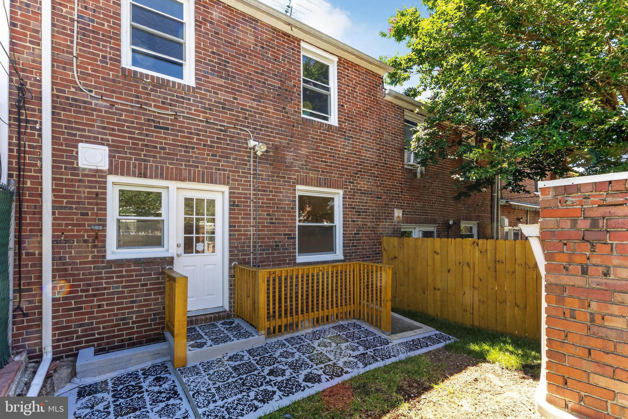 3906 Yolando Road Baltimore, MD 21218 - Photo 26 of 30 a view of a brick house with a large window
