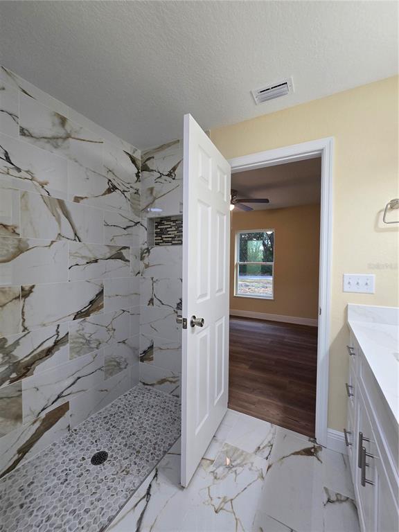 9 Locust Run Track Ocala, FL 34472 - Photo 17 of 38 a bathroom with a shower