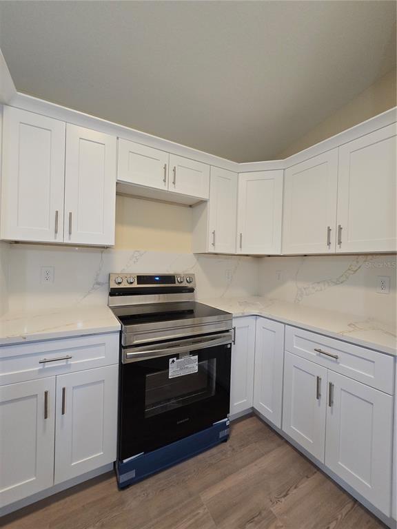 9 Locust Run Track Ocala, FL 34472 - Photo 32 of 38 a kitchen with white cabinets and appliances