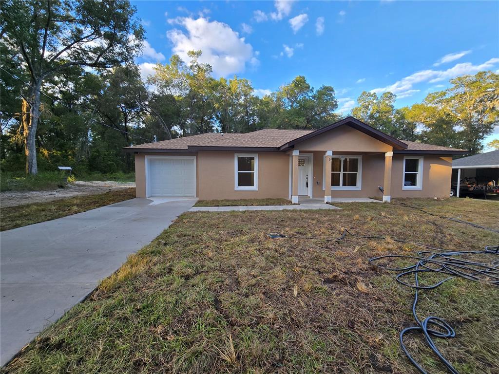 9 Locust Run Track Ocala, FL 34472 - Photo 6 of 38 a view of a house with a yard