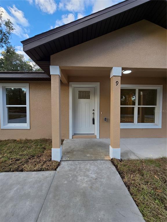 9 Locust Run Track Ocala, FL 34472 - Photo 8 of 38 a front view of a house