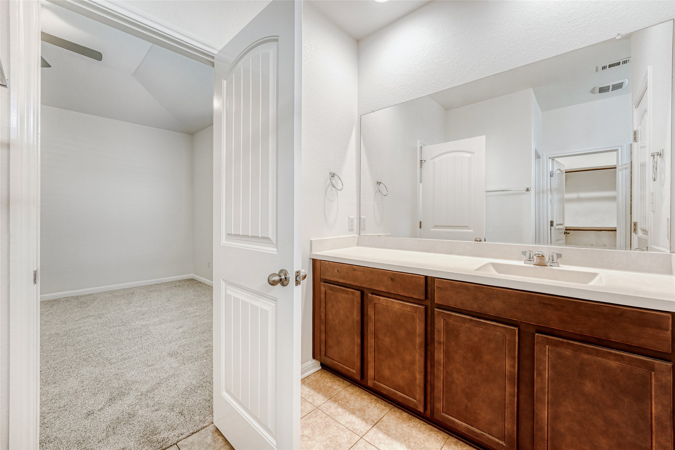 410 Anacua Loop, Unit 30 Manchaca, TX 78652 - Photo 21 of 33 Primary Bathroom with large vanity and light tile patterned flooring