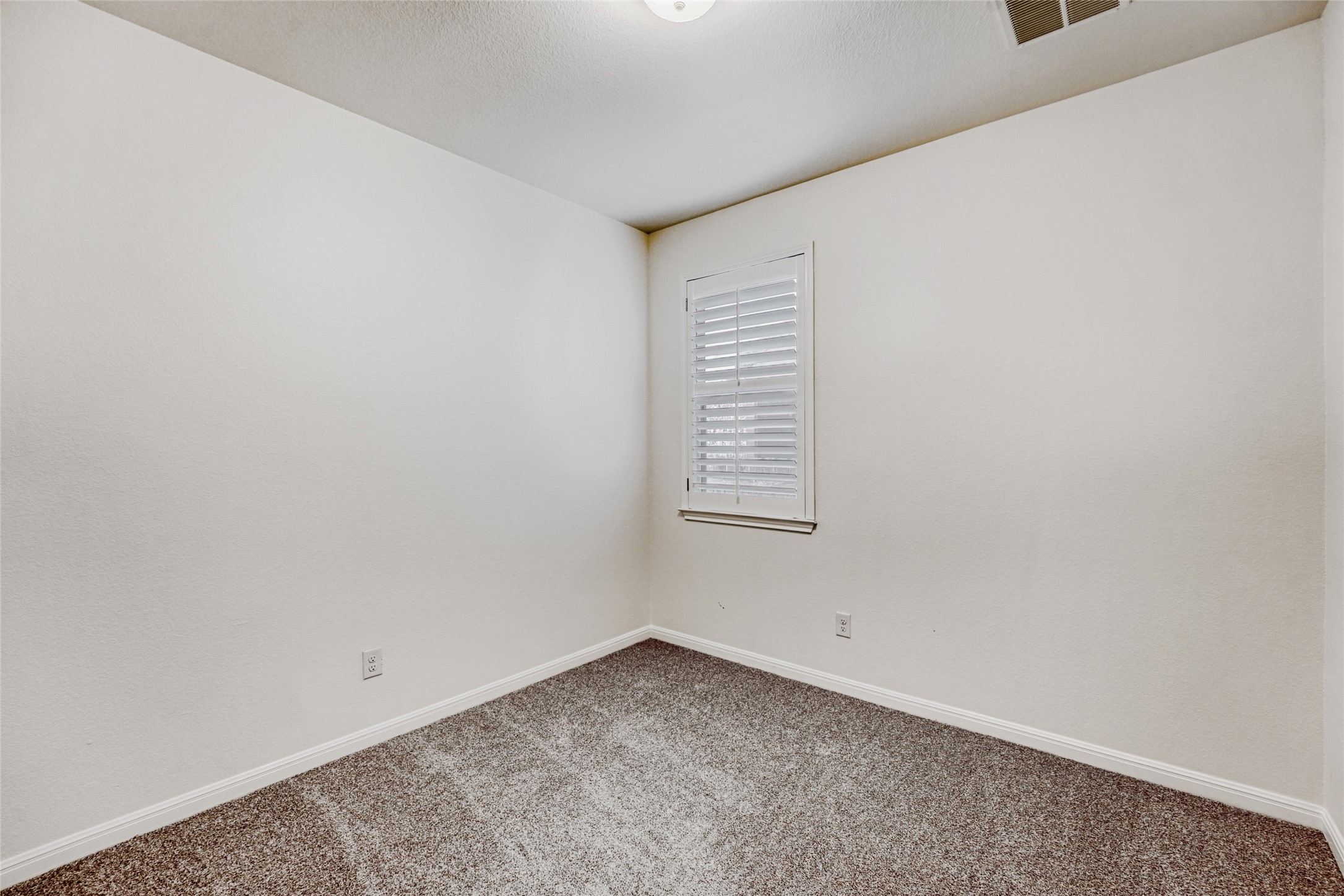 410 Anacua Loop, Unit 30 Manchaca, TX 78652 - Photo 25 of 33 Unfurnished bedroom #2 featuring carpet and a closet