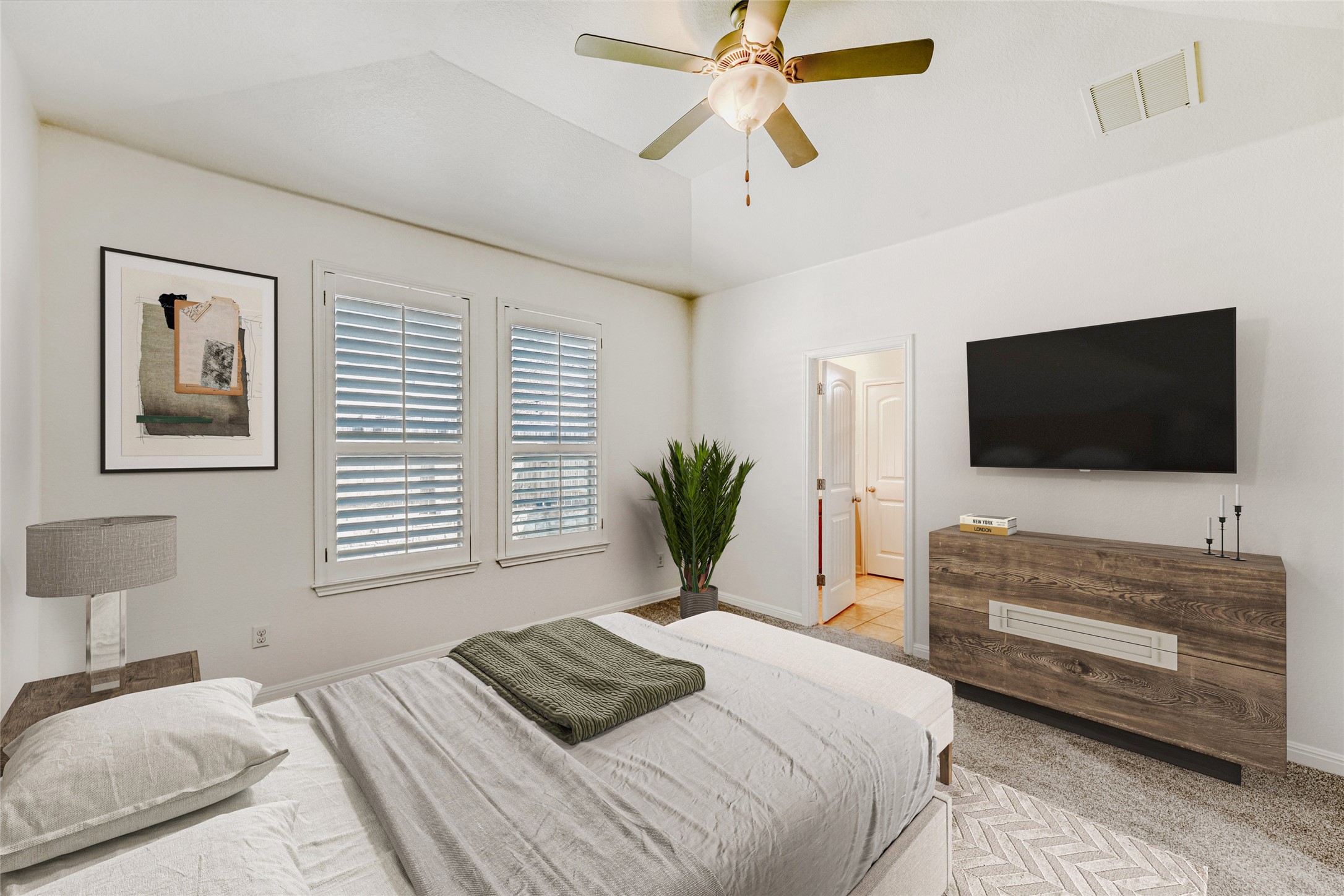 410 Anacua Loop, Unit 30 Manchaca, TX 78652 - Photo 5 of 33 Bedroom featuring a ceiling fan, light carpet, and lofted ceiling