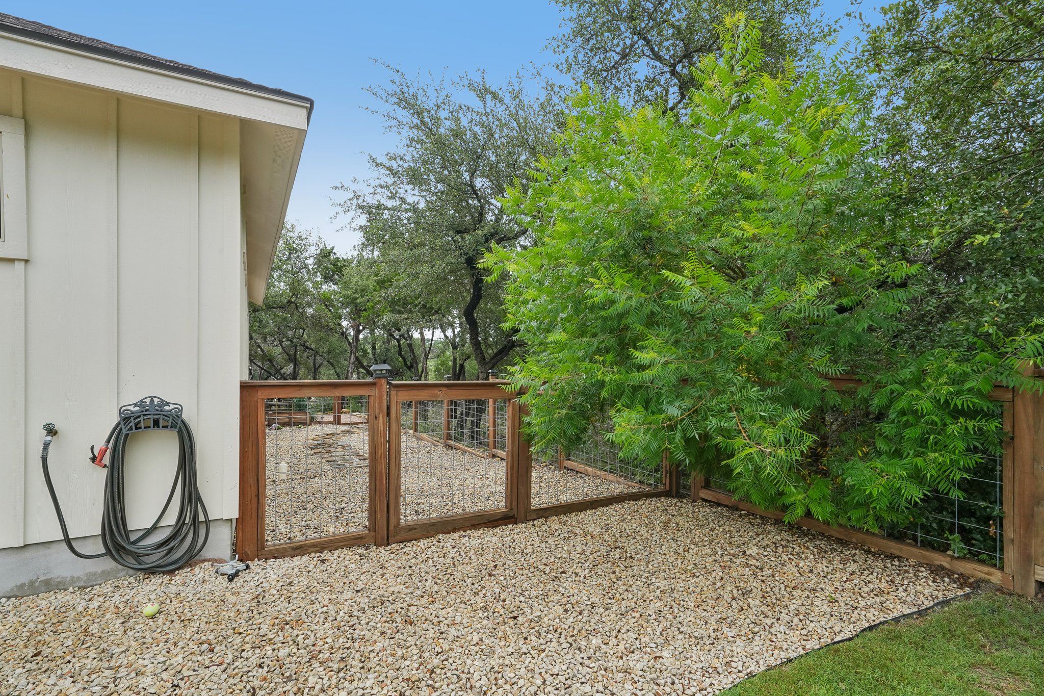 190 Magnolia Meadow Spring Branch, TX 78070 - Photo 19 of 29 Secure, fenced outdoor area with gravel flooring for pets and easy maintenance.
