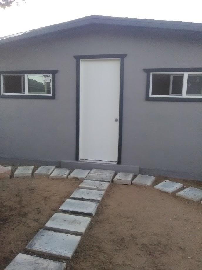 27095 Cote Street Boron, CA 93516 - Photo 13 of 15 a bedroom with a bed and a window