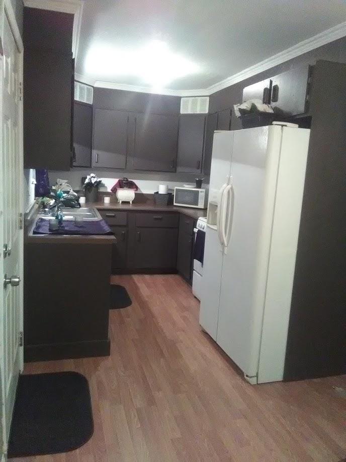 27095 Cote Street Boron, CA 93516 - Photo 4 of 15 a kitchen with refrigerator and mirror