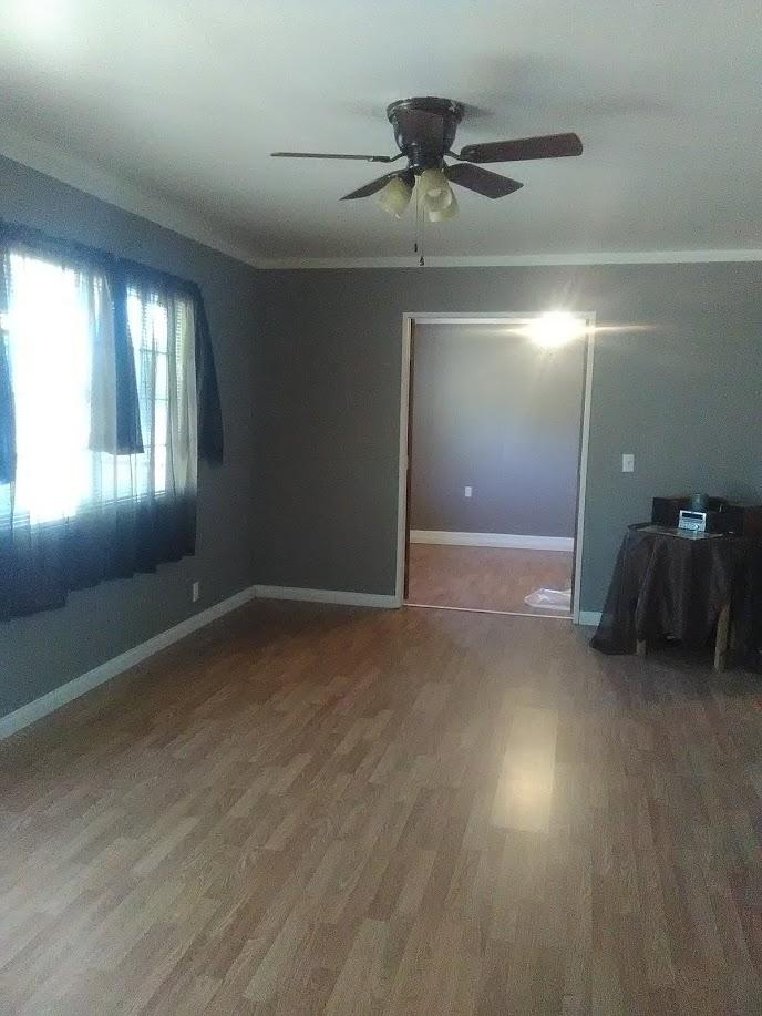 27095 Cote Street Boron, CA 93516 - Photo 5 of 15 a view of a livingroom with a ceiling fan and window