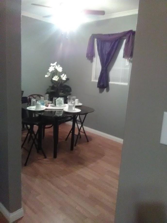 27095 Cote Street Boron, CA 93516 - Photo 7 of 15 a dining room with a table chairs and a chandelier