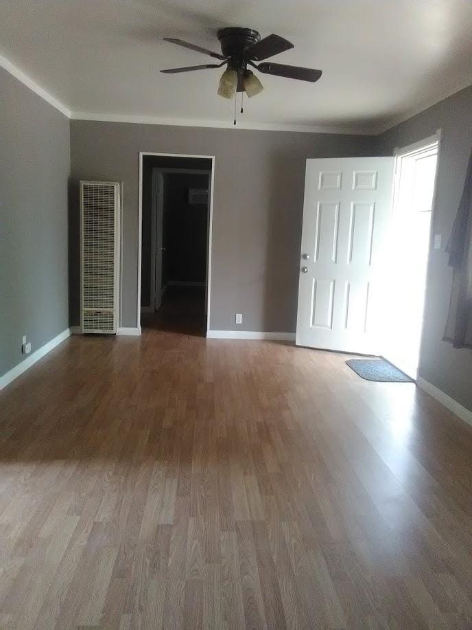 27095 Cote Street Boron, CA 93516 - Photo 9 of 15 wooden floor in an empty room with a window